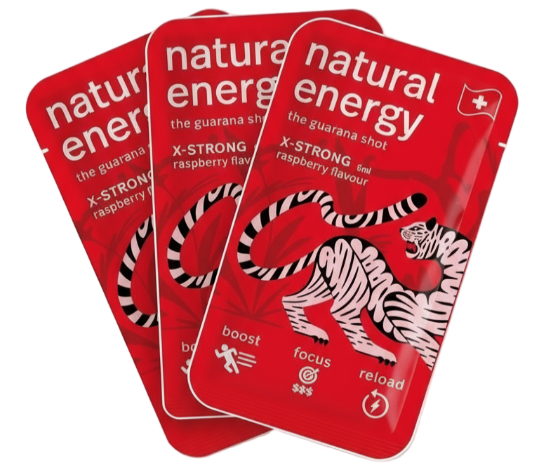 Three X Strong Raspberry packages of 'Natural Energy' guarana shots with a tiger design on a red background.