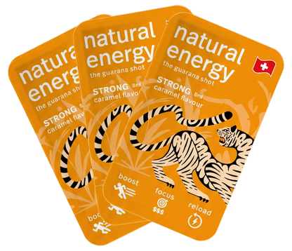 Three strong caramel 'natural energy' guarana shots packaged with a tiger illustration on an orange background.