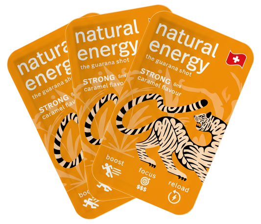 Three strong caramel 'natural energy' guarana shots packaged with a tiger illustration on an orange background.
